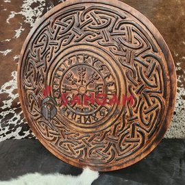 Viking round shield with carved Vegvisir symbol